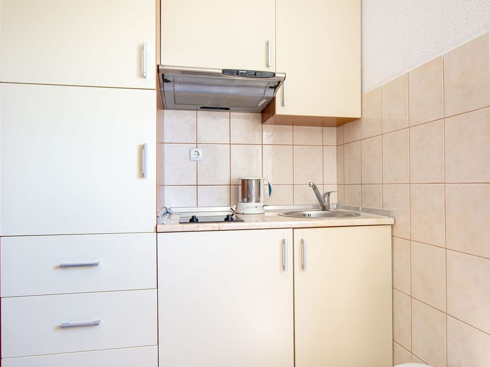 Apartment | Private kitchen | Fridge, highchair