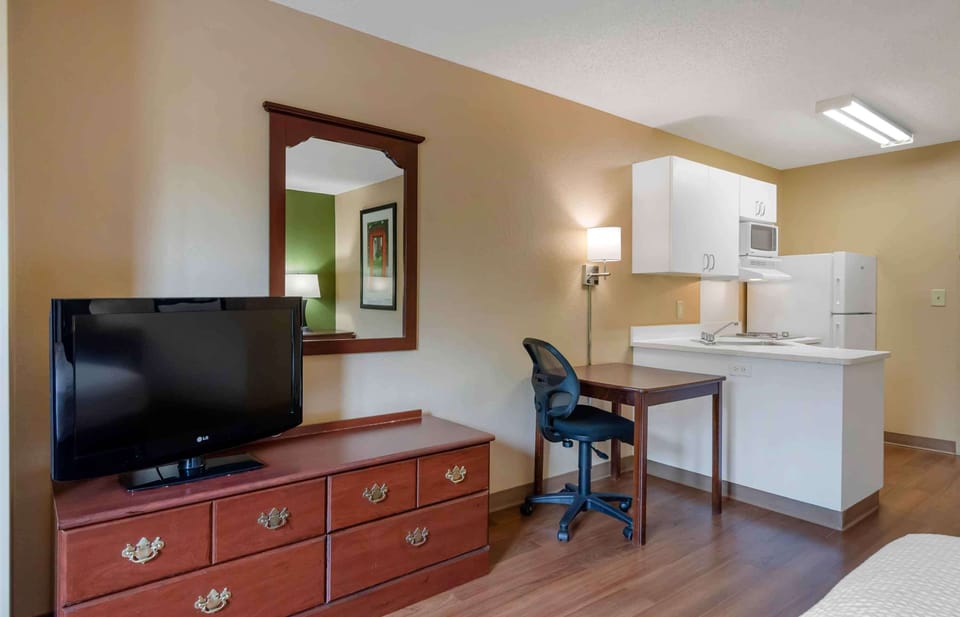 Premium bedding, desk, laptop workspace, iron/ironing board