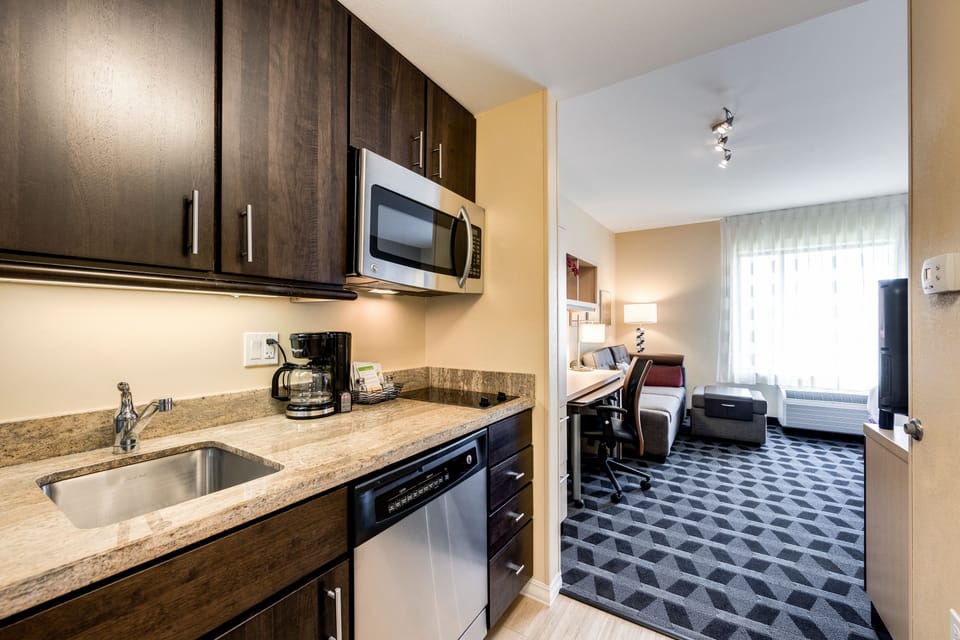 Studio Suite, 1 King Bed with Sofa bed | Private kitchen | Fridge, microwave, stovetop, dishwasher