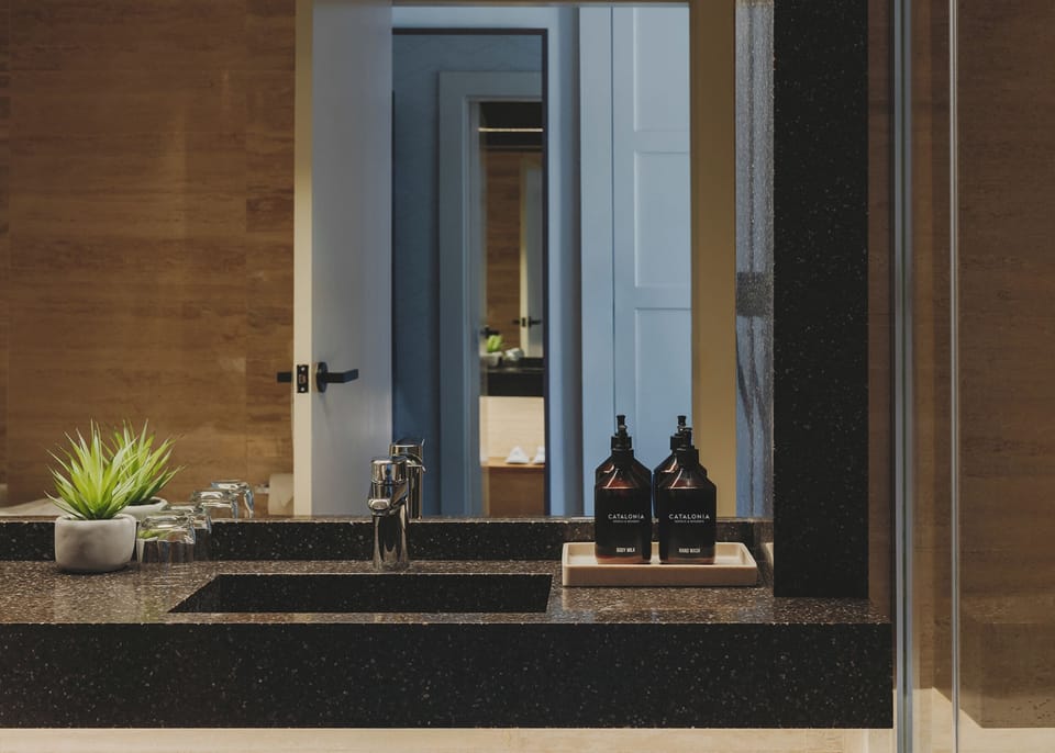 Designer toiletries, hair dryer, slippers, bidet