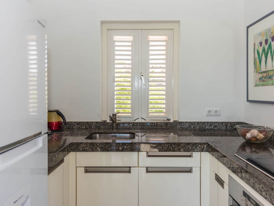 Villa | Private kitchen | Microwave, highchair
