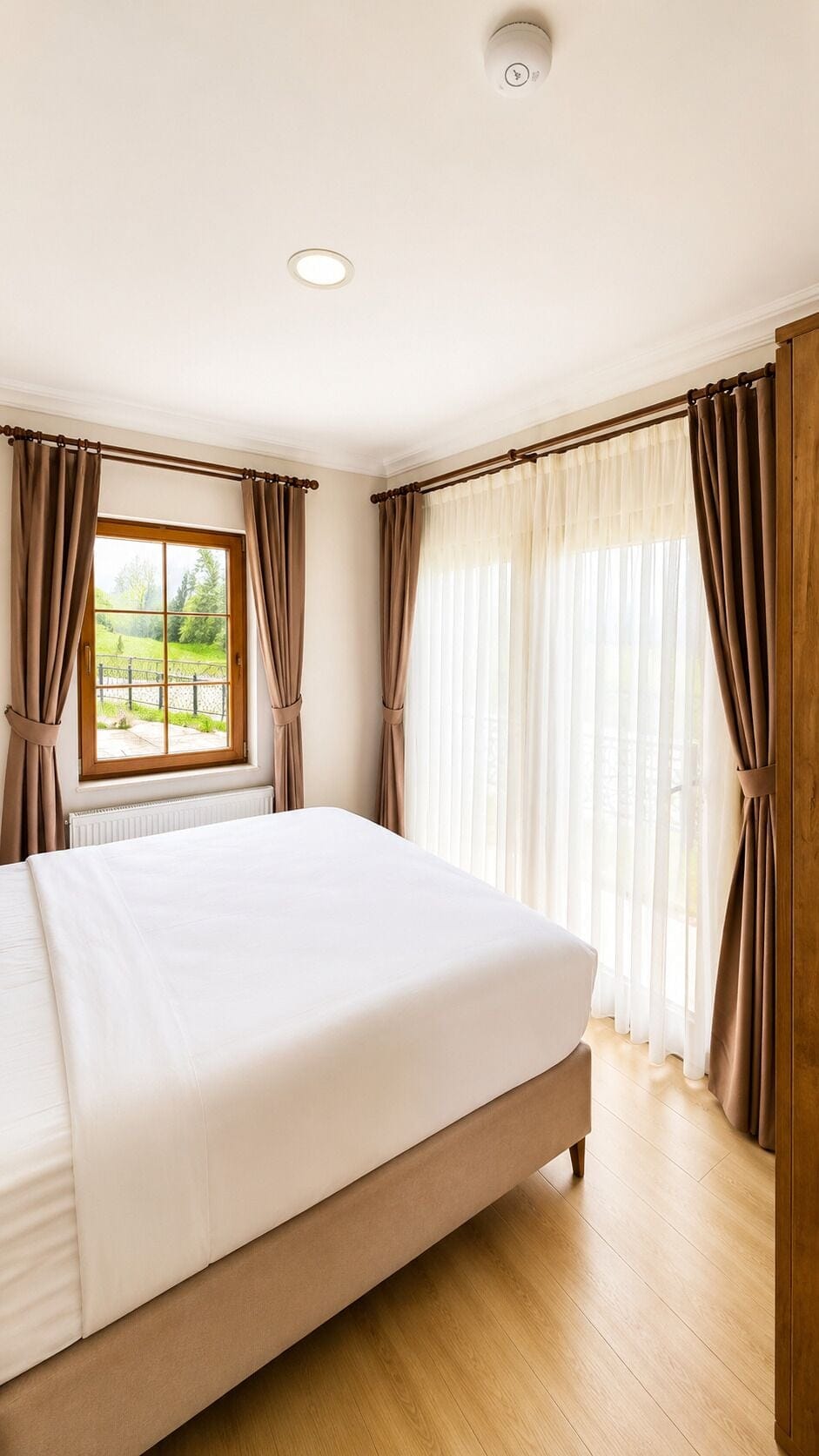 Premium bedding, desk, laptop workspace, blackout drapes