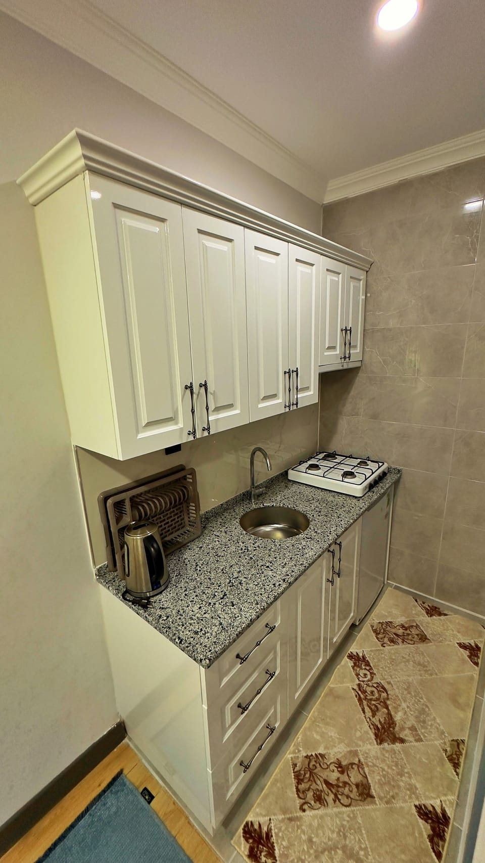 Deluxe Villa | Private kitchen | Fridge, stovetop, electric kettle, highchair