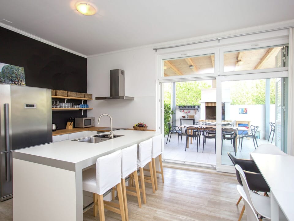 Villa | Private kitchen | Stovetop, coffee/tea maker, highchair, cookware/dishes/utensils
