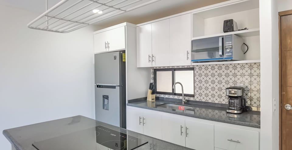 Mini-fridge, microwave, stovetop, coffee/tea maker