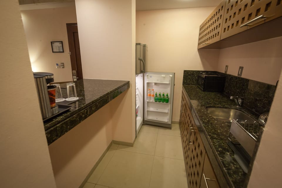 Junior Suite, 1 King Bed | Private kitchen | Coffee/tea maker