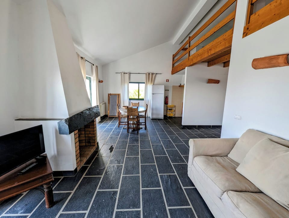 Family Apartment, 1 Bedroom, Sea View | Living area | 33-inch LED TV with cable channels