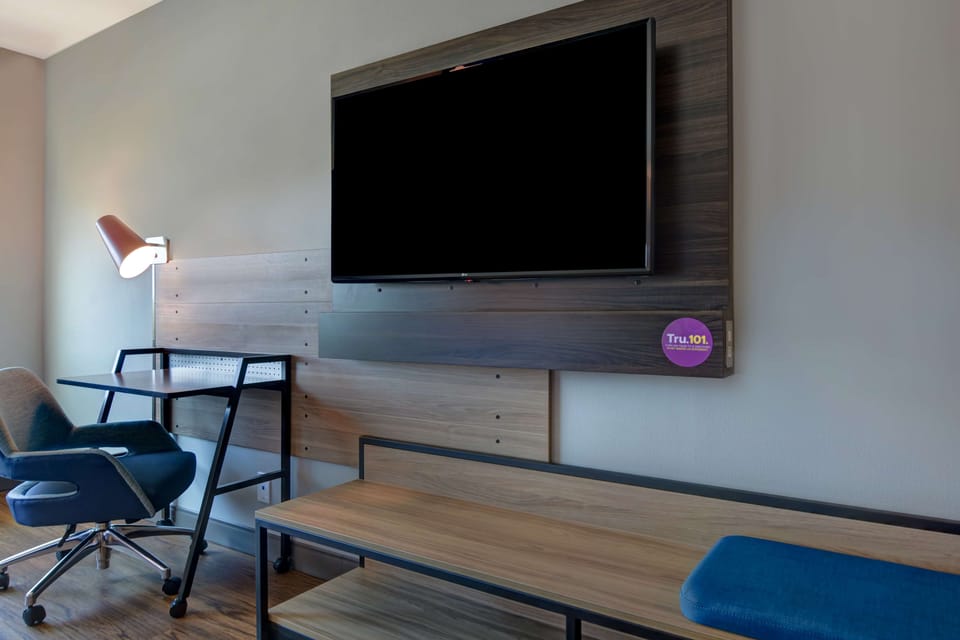 Desk, laptop workspace, blackout drapes, iron/ironing board