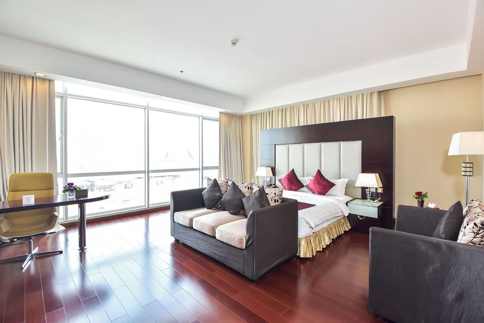 Premier Deluxe King Room - Free Two Ways Airport Transfer | Egyptian cotton sheets, premium bedding, memory foam beds, minibar