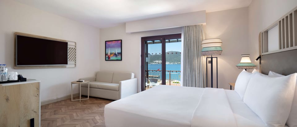 Family Room, 1 King Bed, Terrace | Minibar, in-room safe, desk, laptop workspace