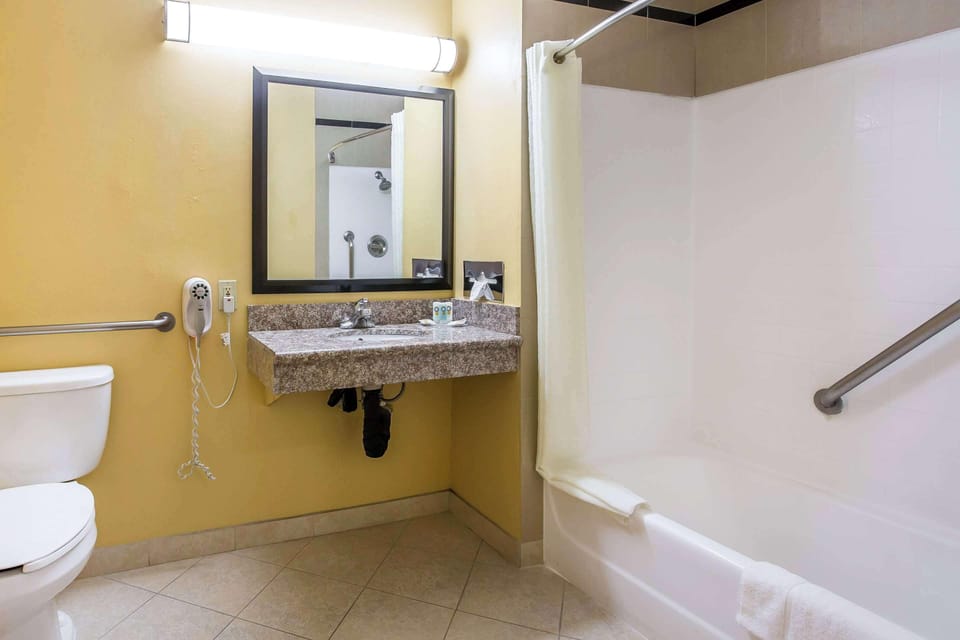 Desk, laptop workspace, blackout drapes, iron/ironing board