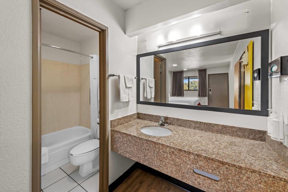 Room, 2 Queen Beds, Non Smoking | Bathroom | Combined shower/tub, hair dryer, towels