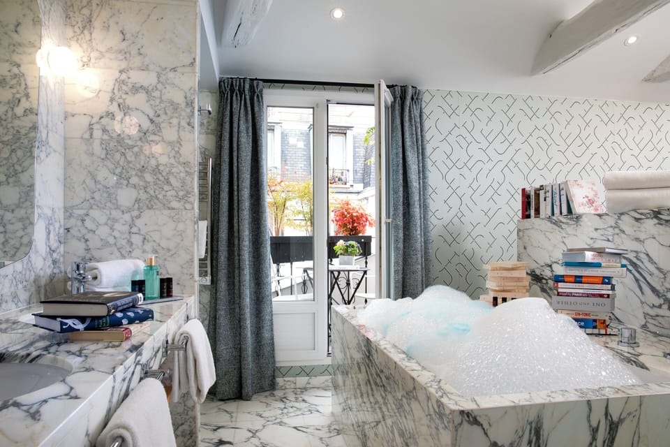 Exclusive Suite | Bathroom | Hair dryer, bathrobes, slippers, towels