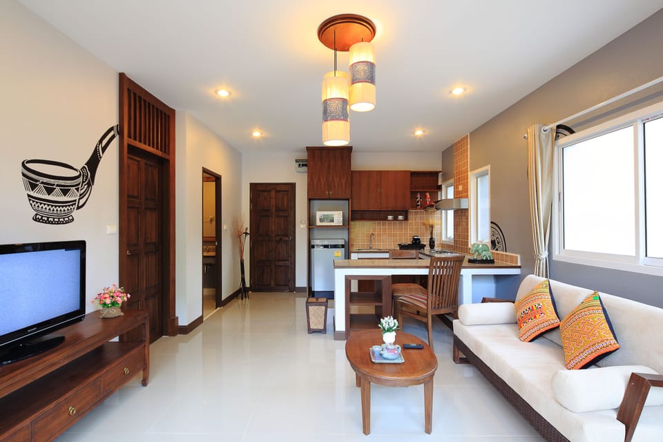 One Bedroom Grand Suite with Balcony | Living area | LED TV, DVD player