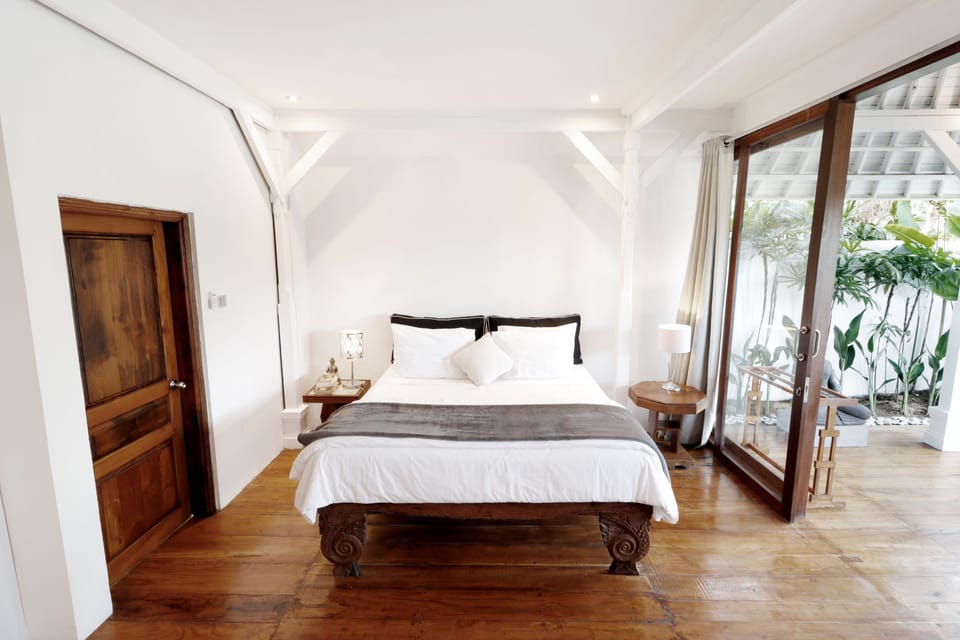 One Bedroom Apartment, Shared Pool | Minibar, in-room safe, individually decorated, individually furnished