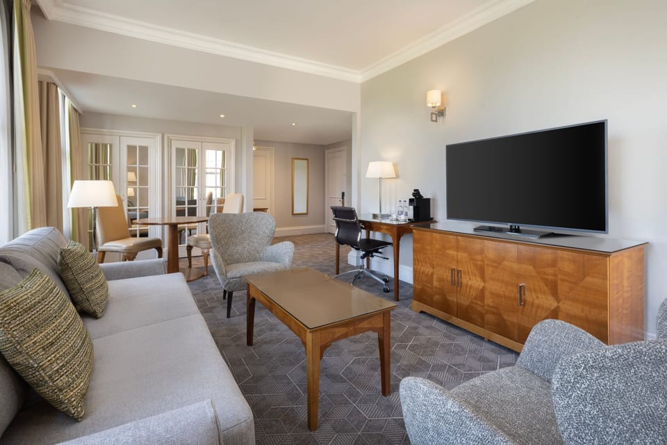 Suite, 1 Bedroom | Living room | 49-inch Smart TV with cable channels, TV