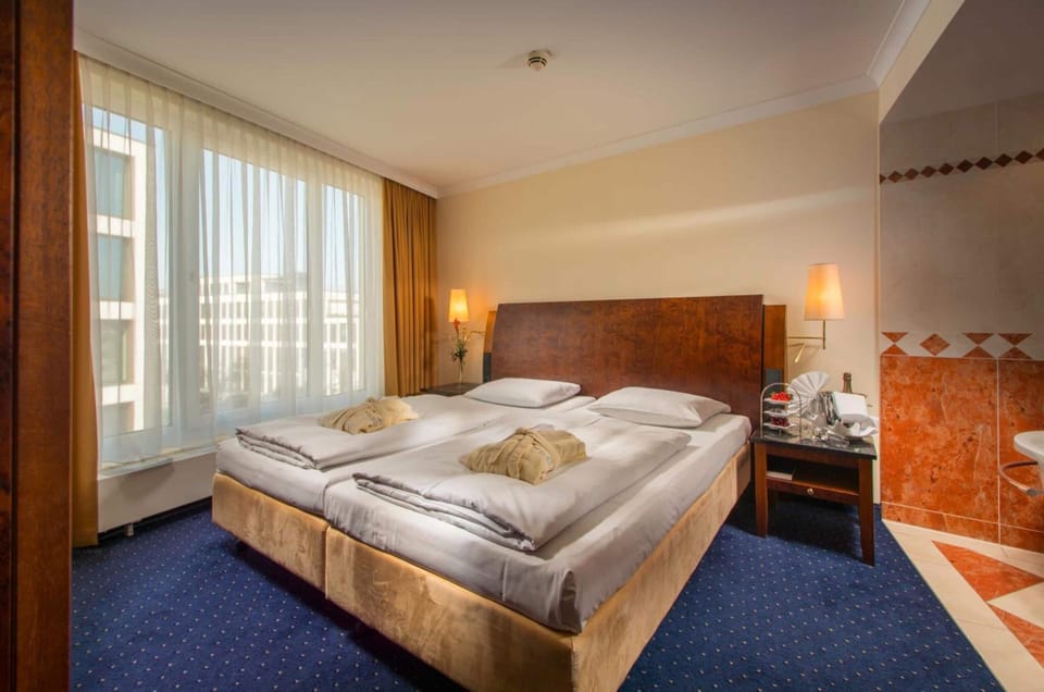 Hypo-allergenic bedding, down comforters, memory foam beds, minibar
