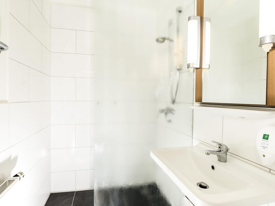 Shower, eco-friendly toiletries, hair dryer, towels