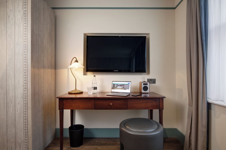 Bloomsbury Bedroom | Premium bedding, in-room safe, desk, iron/ironing board
