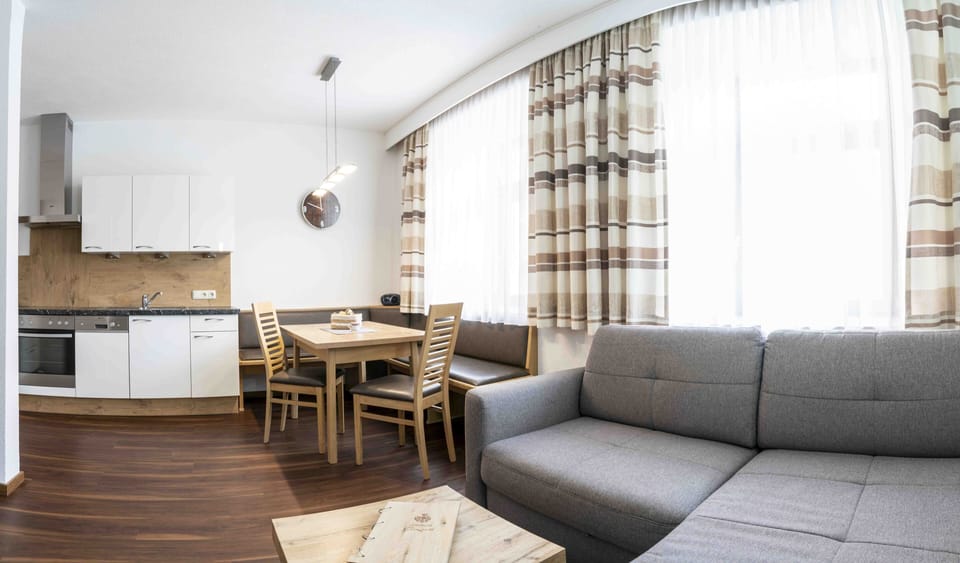 Deluxe Apartment, 2 Bedrooms, Mountainside | Living area | 49-cm flat-screen TV with cable channels, TV