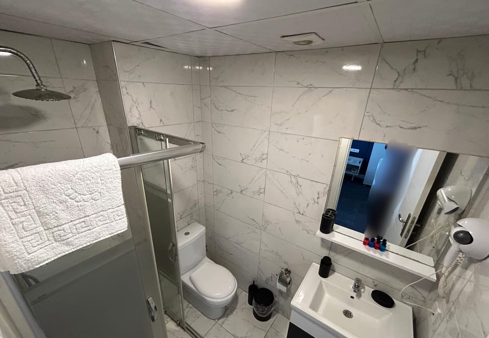 Shower, free toiletries, hair dryer, towels