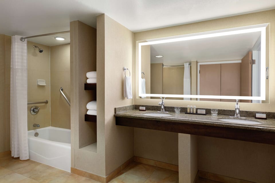 Suite, 2 Double Beds, Accessible (Mobility & Hearing, Roll-in Shower) | Bathroom | Combined shower/tub, designer toiletries, hair dryer, towels