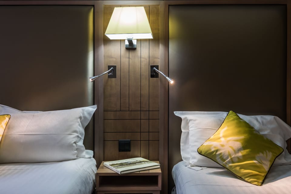 Family Triple Room | Minibar, in-room safe, individually decorated, desk