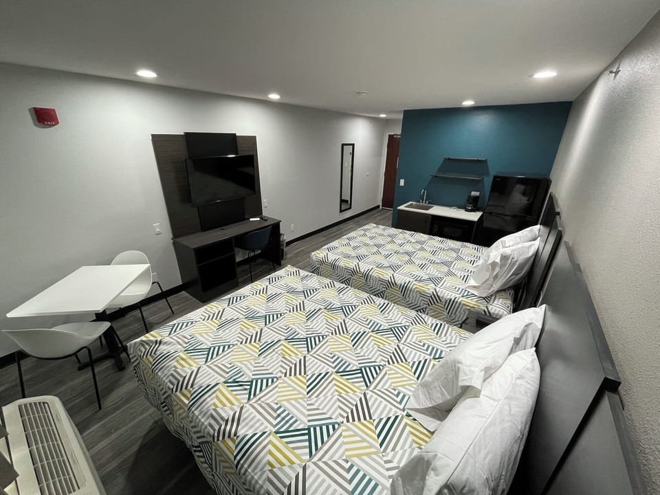 Desk, laptop workspace, blackout drapes, iron/ironing board