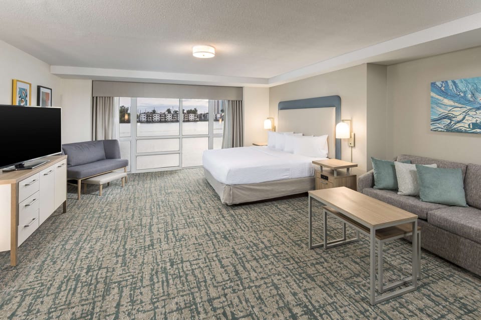Studio, 1 King Bed, Accessible, Bathtub | Living area | 32-inch plasma TV with satellite channels, TV