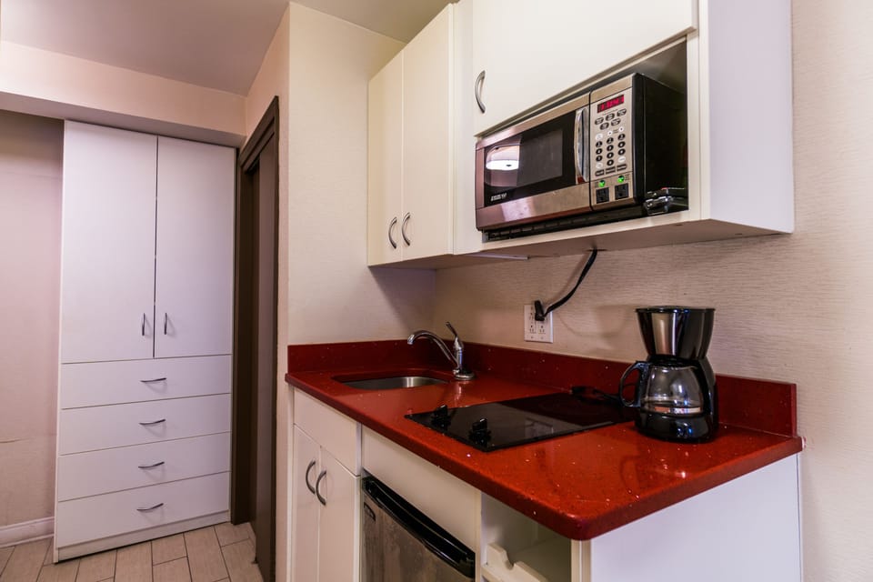 Deluxe Room, 2 Double Beds | Private kitchen | Fridge, microwave, stovetop, coffee/tea maker