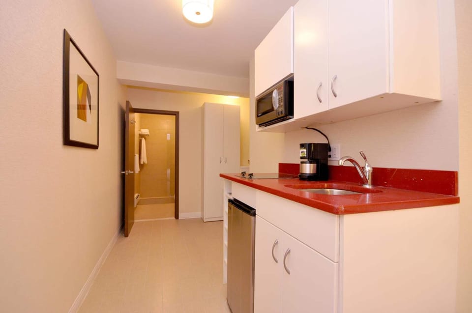 Fridge, microwave, stovetop, coffee/tea maker