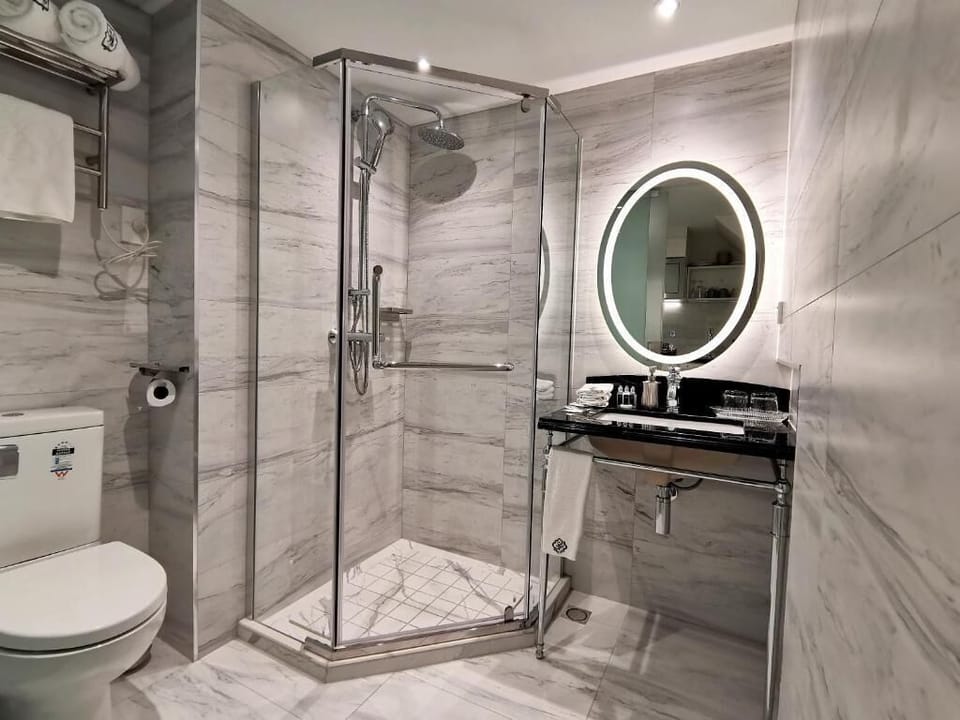 Designer toiletries, hair dryer, bathrobes, towels