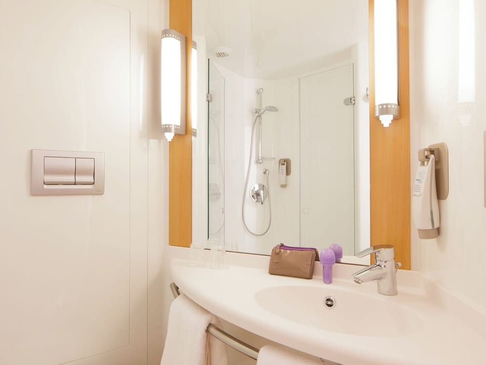 Shower, eco-friendly toiletries, hair dryer, towels