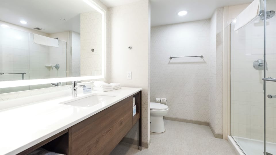 Designer toiletries, hair dryer, towels, soap