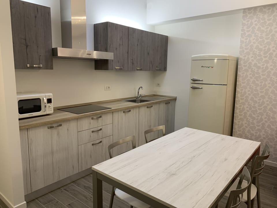 Apartment, Balcony | Private kitchen | Coffee/tea maker, electric kettle