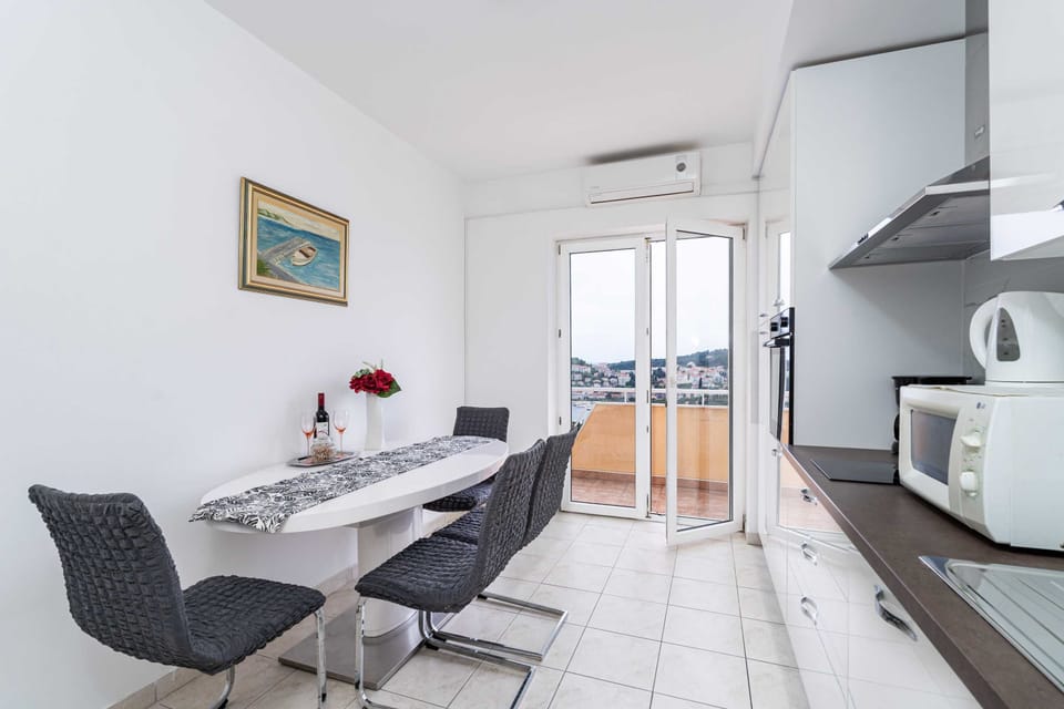 Apartment (One Bedroom Apartment with Balcony) | Private kitchen | Fridge, microwave, electric kettle