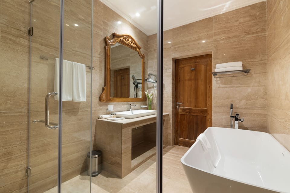 Family suite Room | Bathroom | Rainfall showerhead, designer toiletries, hair dryer, bathrobes