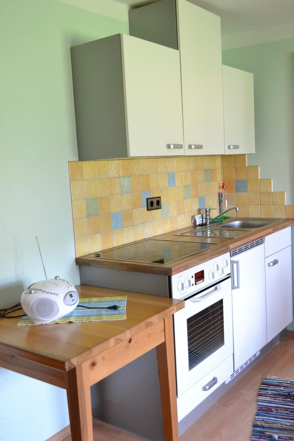 Family Apartment | Private kitchen | Shared fridge, microwave, highchair