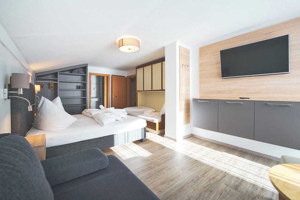 Quadruple Room, Balcony | In-room safe, individually decorated, individually furnished