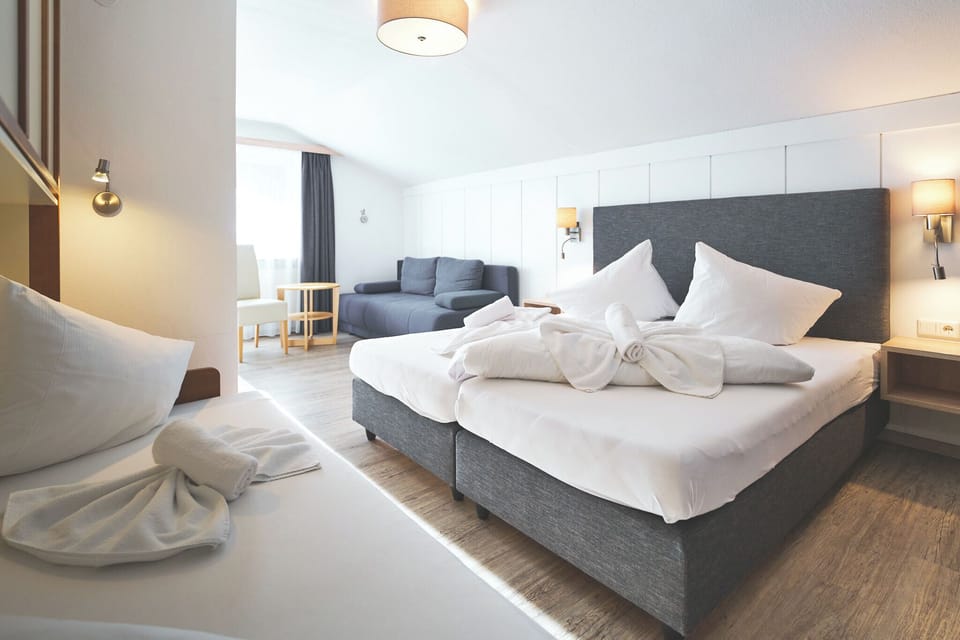 Quadruple Room, Balcony | In-room safe, individually decorated, individually furnished
