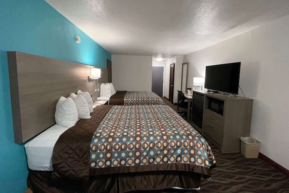 Room, 2 Queen Beds, Non Smoking | Blackout drapes, iron/ironing board, free cribs/infant beds