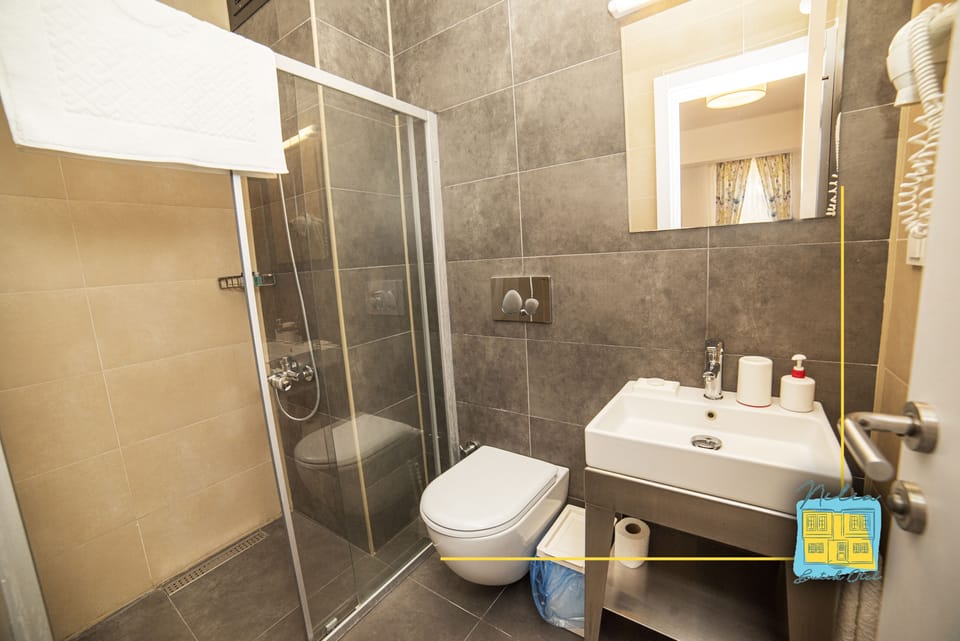 Shower, free toiletries, hair dryer, slippers