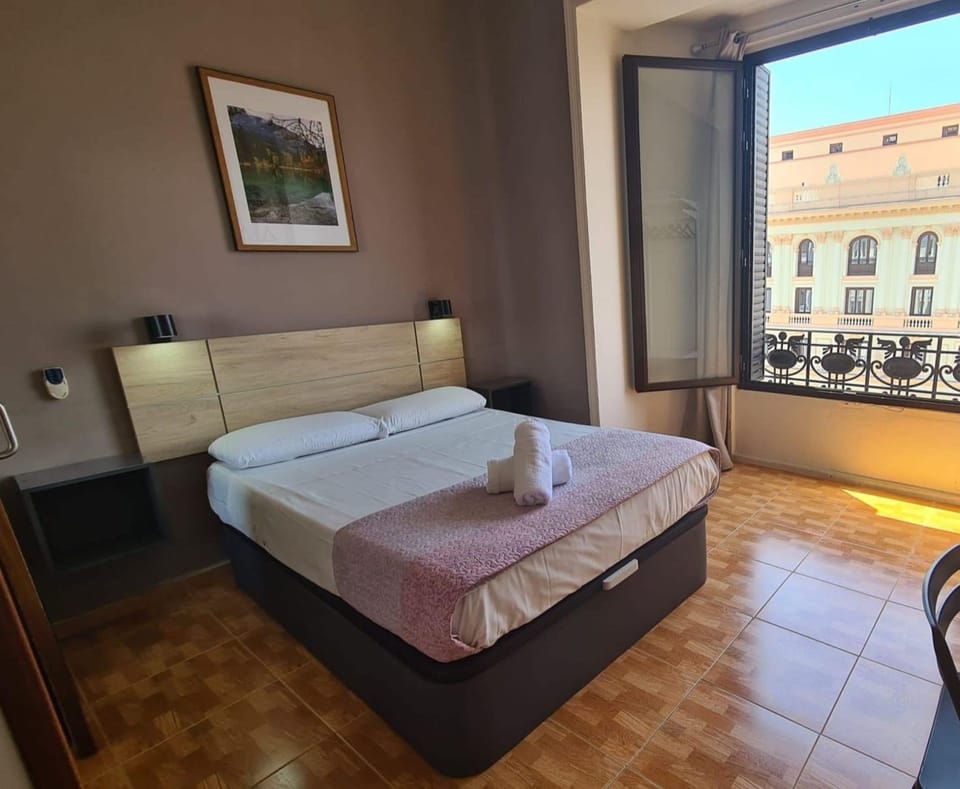 Deluxe Double Room, Private Bathroom | Desk, laptop workspace, bed sheets