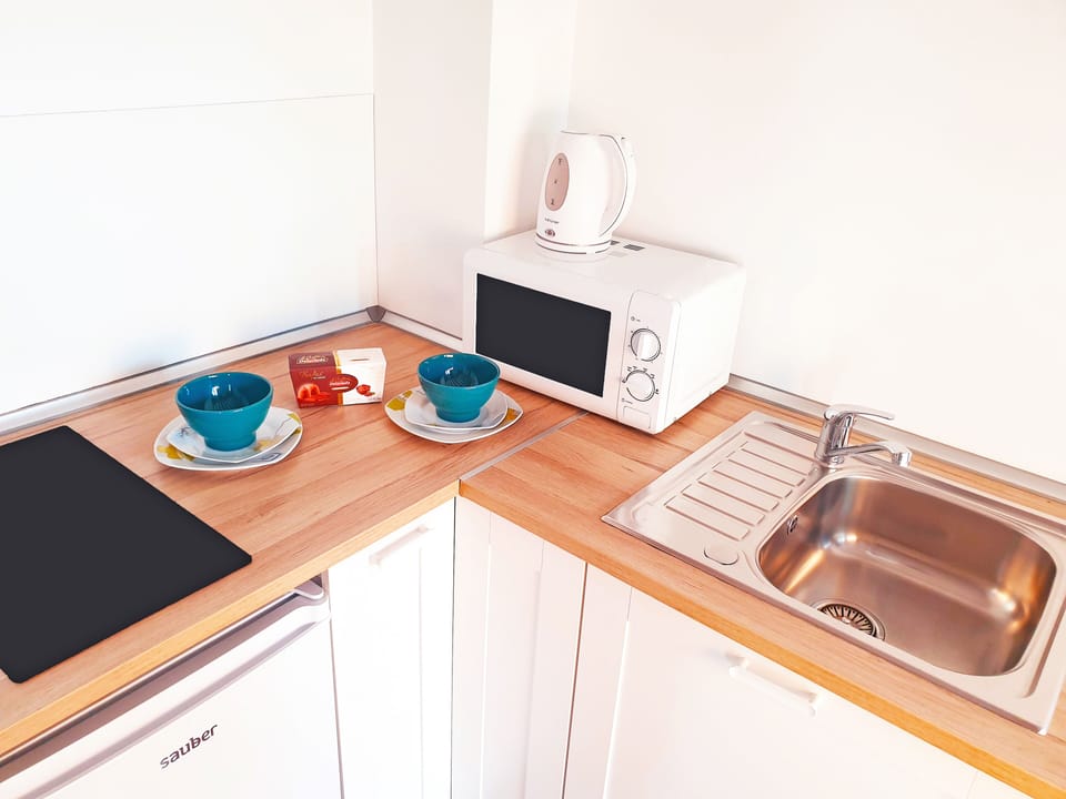 Mini-fridge, microwave, coffee/tea maker, electric kettle