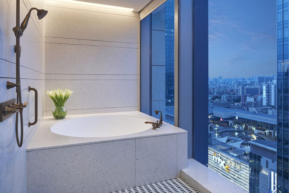 Separate tub and shower, rainfall showerhead, eco-friendly toiletries