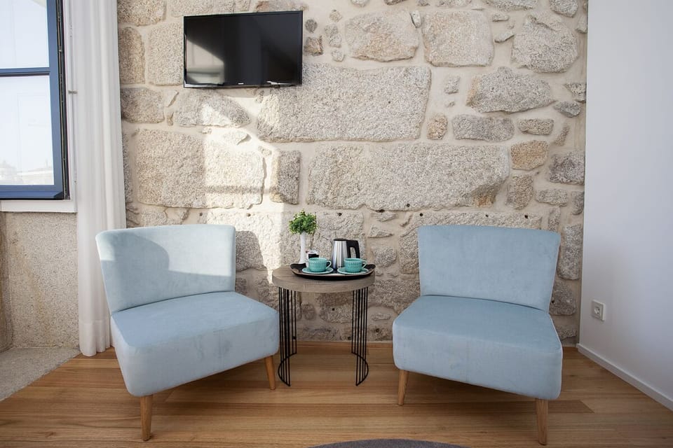Deluxe Double Room | Living area | Plasma TV, heated floors