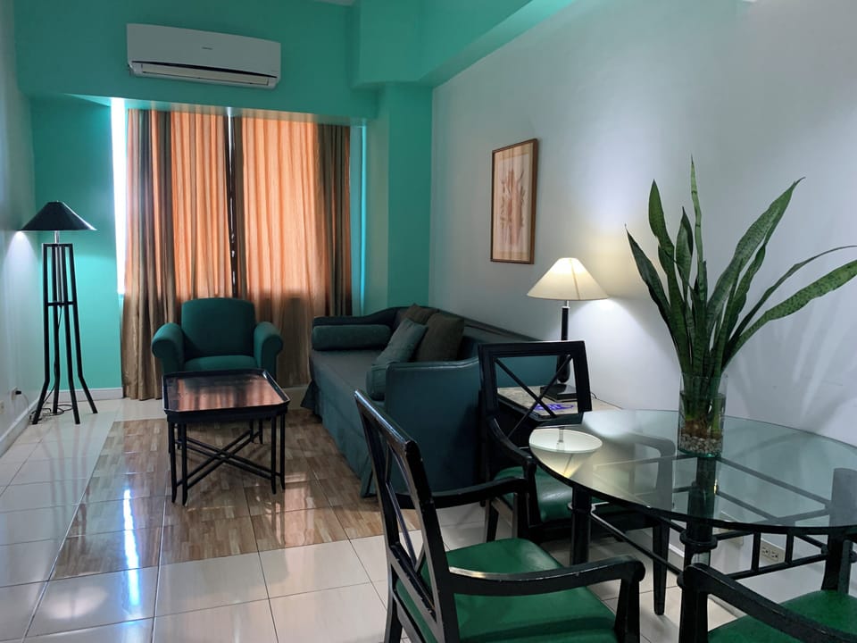 Junior Double Room, 1 King Bed | Living area | TV