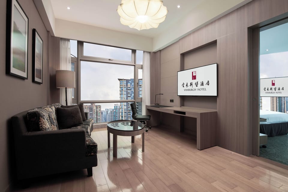 Business Suite | Living area | 37-inch LCD TV with digital channels, TV, iPod dock