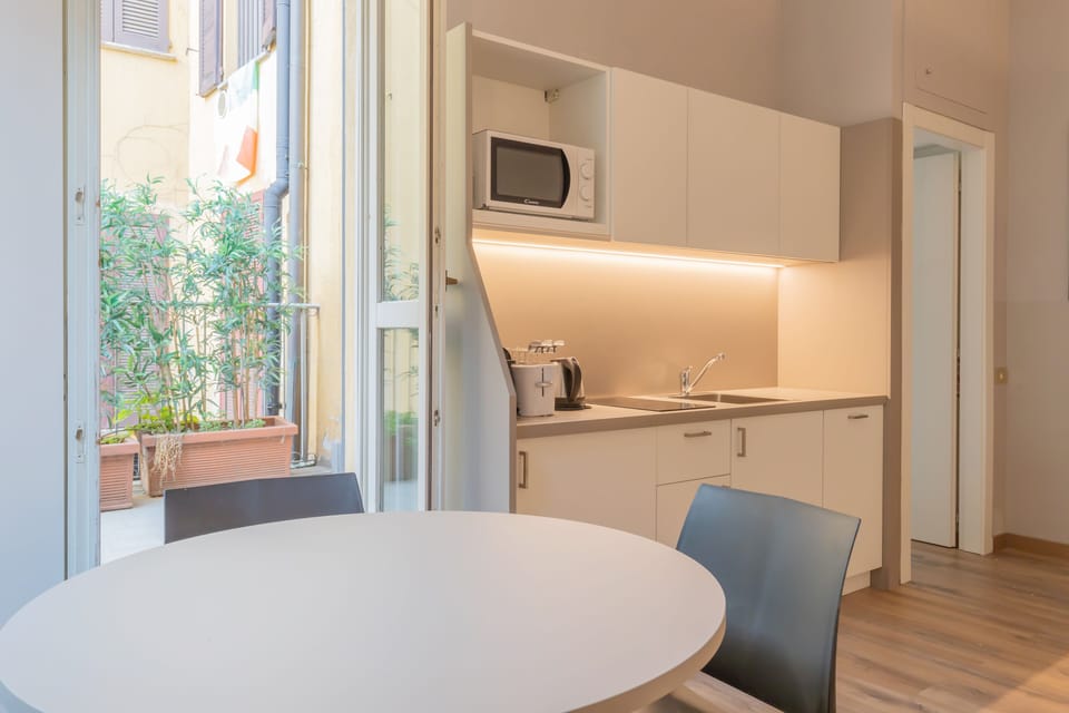 Luxury Studio (Via del Bollo 1) | Living area | 40-inch flat-screen TV with digital channels, TV