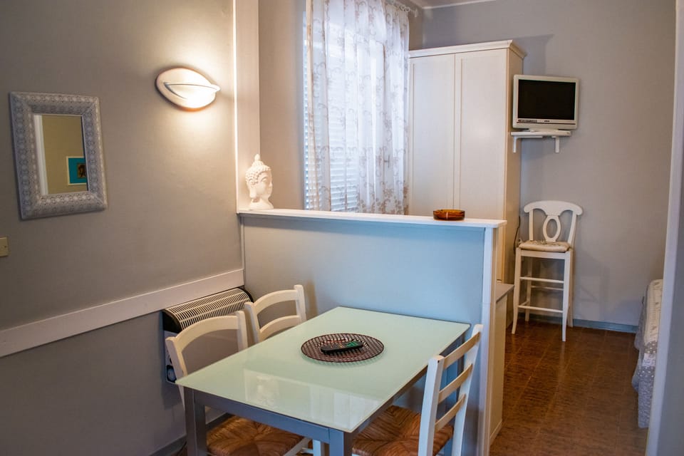 Superior Double Room, Kitchenette | Living room | Flat-screen TV